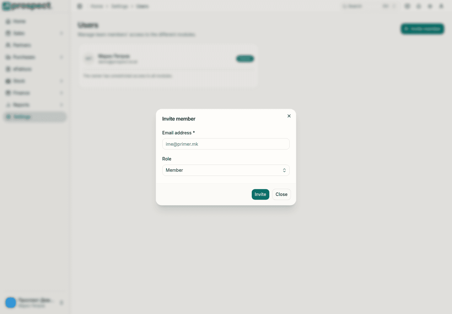 Invite member window on the Users page with an email address field, a role selector and the Invite button